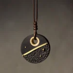Handcrafted ebony wood and brass Buddhist peace pendant necklace - round design with hammered texture and brass detailing, front hanging view