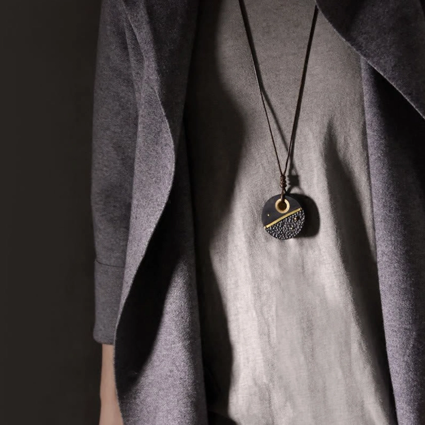 Wearing effect of handcrafted ebony wood Buddhist peace pendant necklace on-body, showing actual size and styling