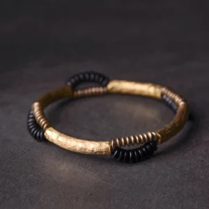 Handmade ebony wood and copper Buddhist bracelet flat lay top-down view showing hammered copper segments and mixed black wooden spacer beads