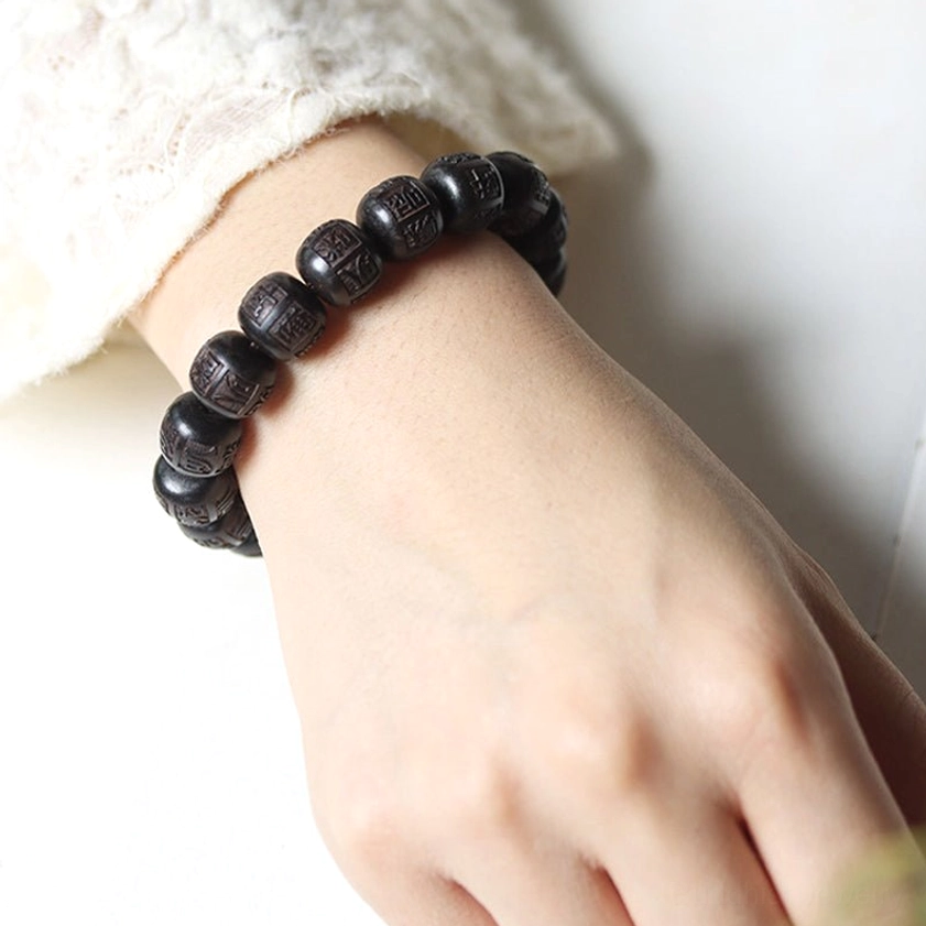 Ebony wood Om Mani Padme Hum bracelet showcase featuring sacred mantra for spiritual balance and protection