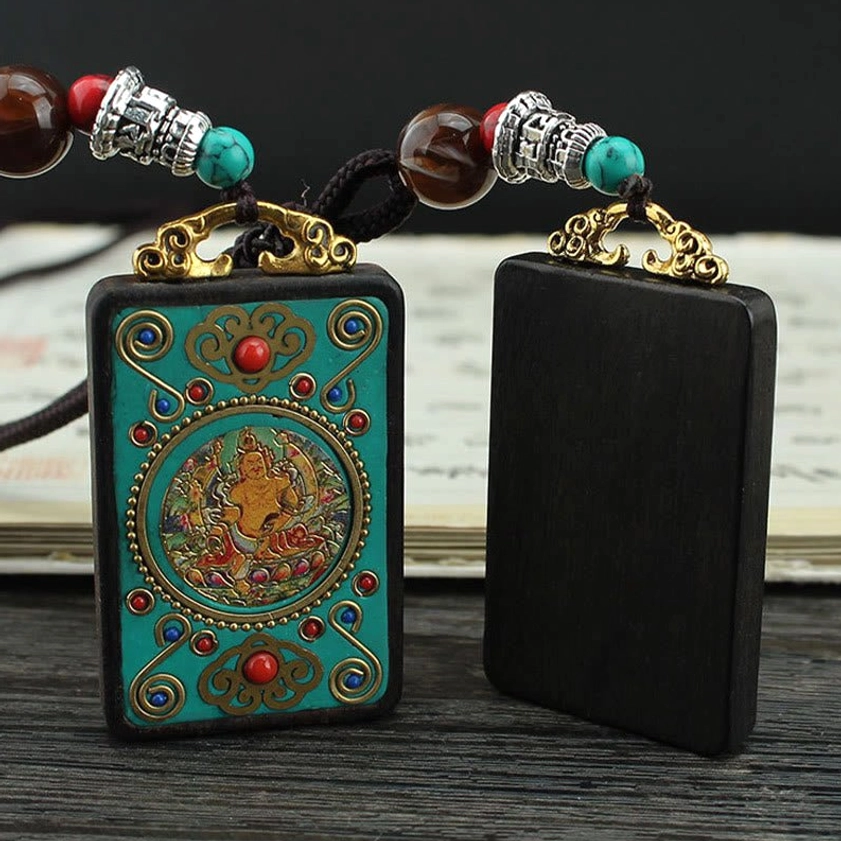 Ebony wood thangka pendant comparison - blank versus hand-painted deity design