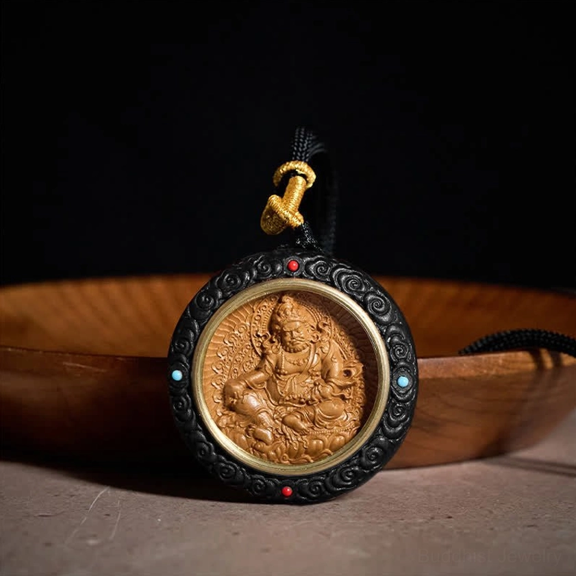 Ebony wood Yellow Jambhala Buddhist pendant front view with colored bead inlays and gold inner ring detail