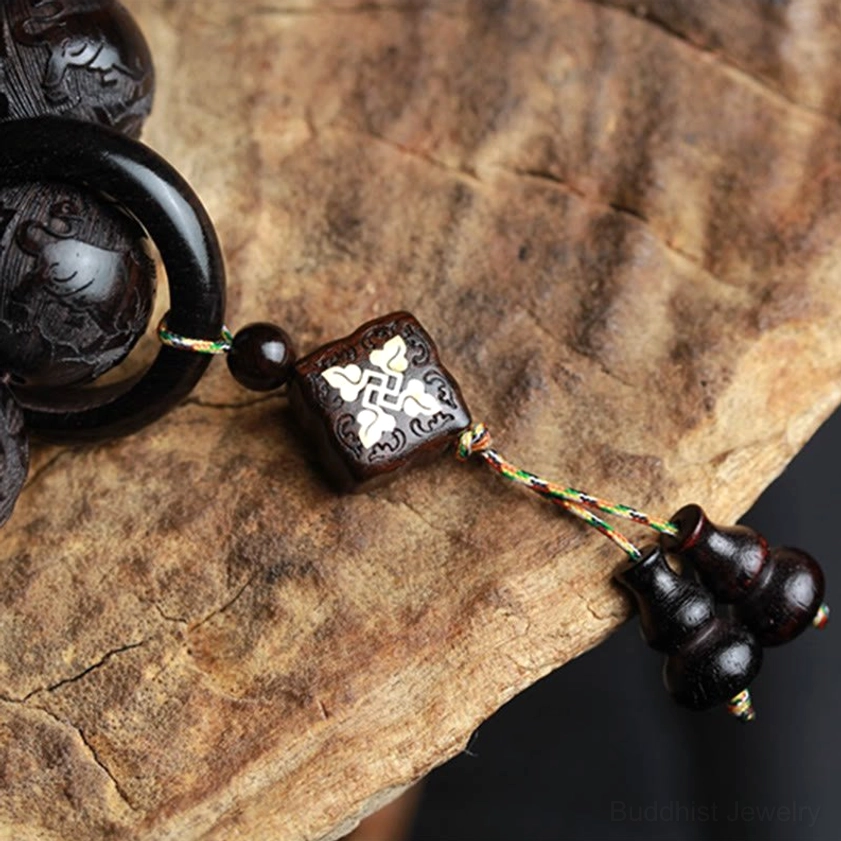 Ebony wood yin yang carved spiritual bracelet lifestyle shot showing wearable balance and harmony symbol for Buddhist meditation and daily mindfulness practice