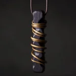 Ebony wood zen circle brass pendant necklace front close-up view with intricate brass wire wrapping detail