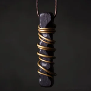 Ebony wood zen circle brass pendant necklace front close-up view with intricate brass wire wrapping detail