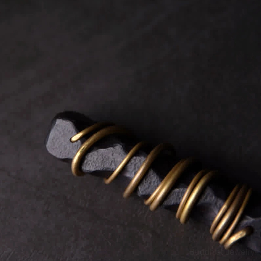 Ebony wood brass zen pendant oblique angle showing elongated wood shape and multiple brass rings
