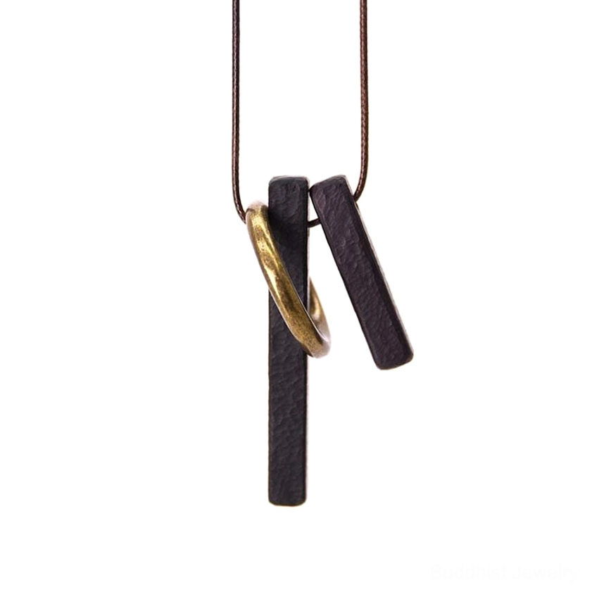 Ebony wood Zen circle Buddhist pendant front view on white background showing brass accents