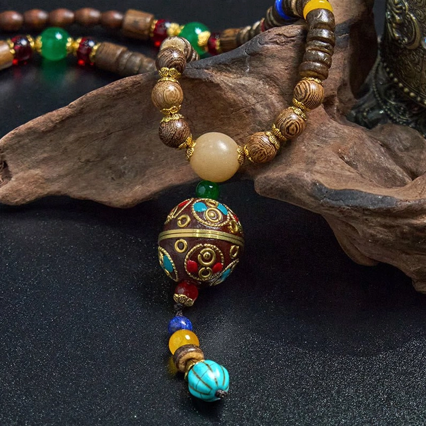 Natural eco-friendly Buddhist necklace featuring coconut shell beads and sacred mantra design