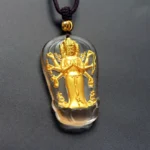 Eight-armed Avalokitesvara Liuli crystal gold-plated Buddhist pendant necklace frontal close-up view with brown braided cord and gold beads