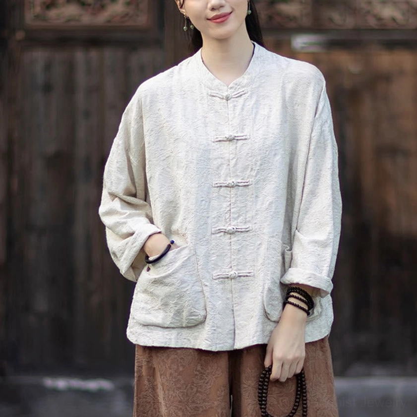 Detail view of elastic waistband and ankle-length pants in cotton-linen blend