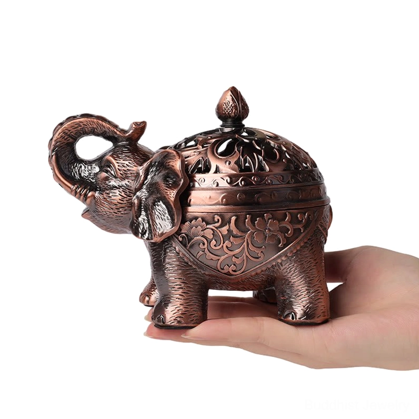 Handcrafted elephant bronze incense burner with floral carved details, held in hand showing side profile and removable dome lid