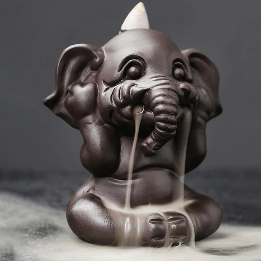 Close-up detail of handcrafted elephant incense burner showing artisan craftsmanship and ceramic quality finish
