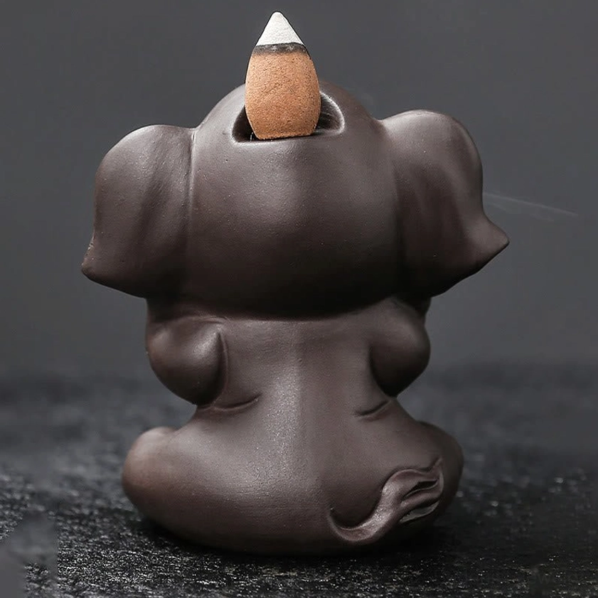 Elephant purple clay backflow incense burner artistic photography showing aesthetic beauty and spiritual ambiance