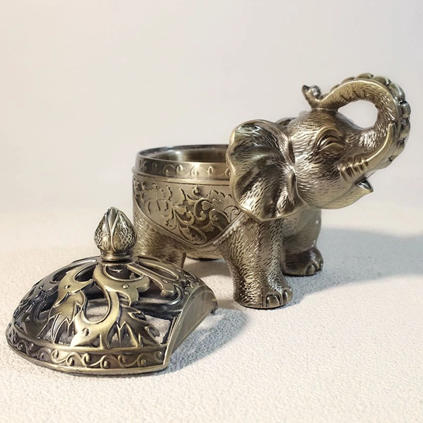 Elephant incense burner displayed as home décor accent piece with warm antique finish suitable for living room or bedroom
