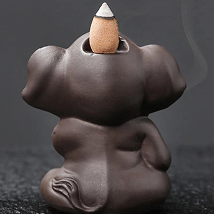 Elephant incense burner lifestyle photography showing meditation practice mindfulness space spiritual environment