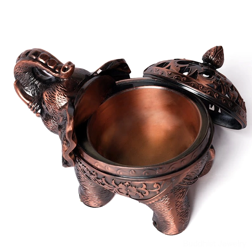 Open elephant incense burner top-down view showing removable carved lid and exposed bronze cavity for incense cone placement
