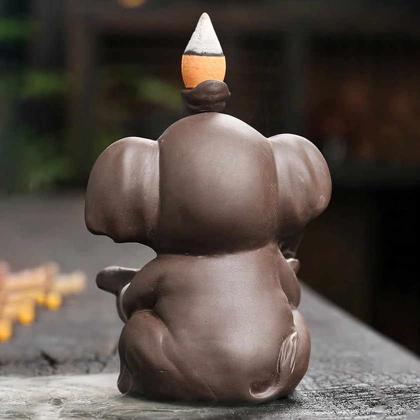 Rear view of purple clay elephant incense burner showing back detail and solid construction