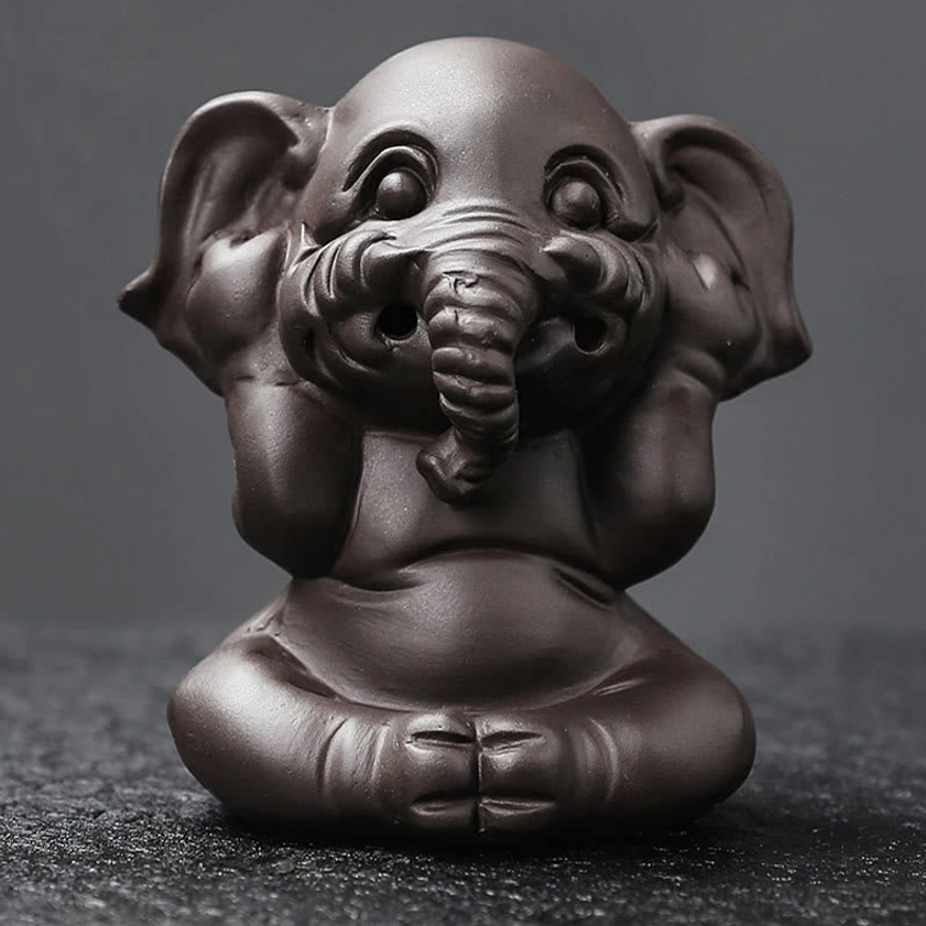 Handcrafted elephant incense burner side profile view showing sculptural design and ceramic form