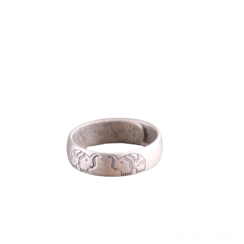 Silver elephant engraved Buddhist blessing ring with matte finish on clean white background