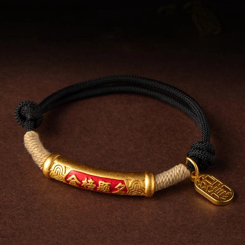 Close-up embossed mantra text on silver charm tube handmade Buddhist bracelet detail