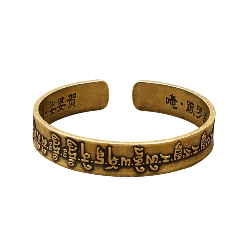 Front facing Sanskrit mantra open cuff bracelet showing embossed mantras and adjustable design