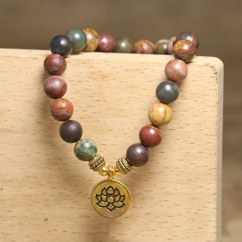 Emperor Stone lotus charm bracelet, natural stone beads with gold-toned metal accents, handcrafted spiritual jewelry product shot