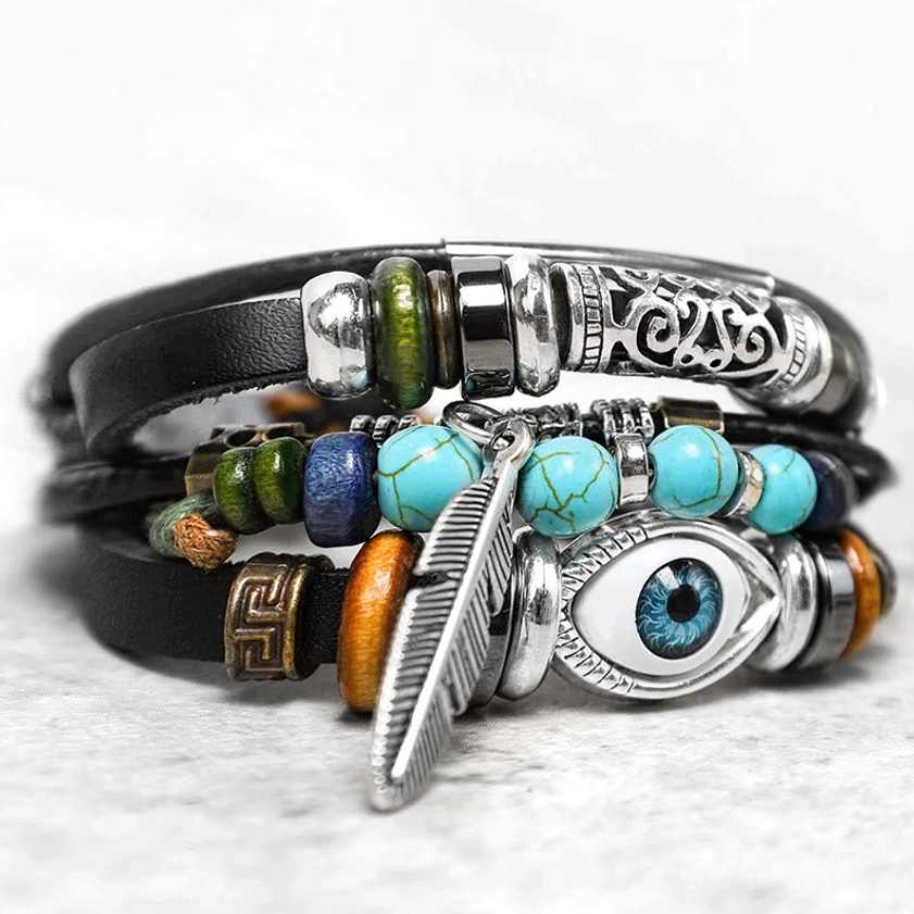 Evil Eye turquoise beaded bracelet side angle showing mixed colored beads and Greek key charm detail