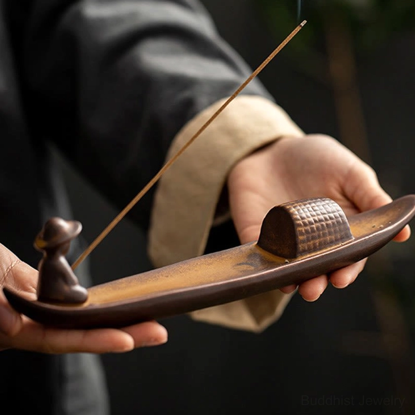 Handcrafted ceramic fisherman boat incense burner artistic detail showing sculptural elements