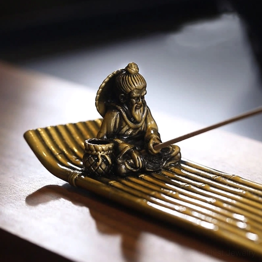 Detailed side view of traditional fisherman with fishing gear on textured bamboo woven base incense burner