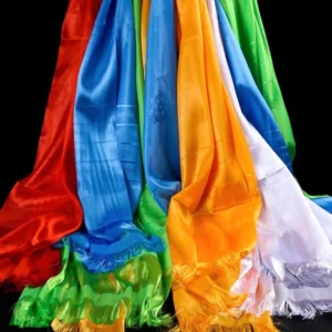 Multi-color five blessing khata scarves displayed with hanging oblique view showing satin fabric texture and embossed religious patterns