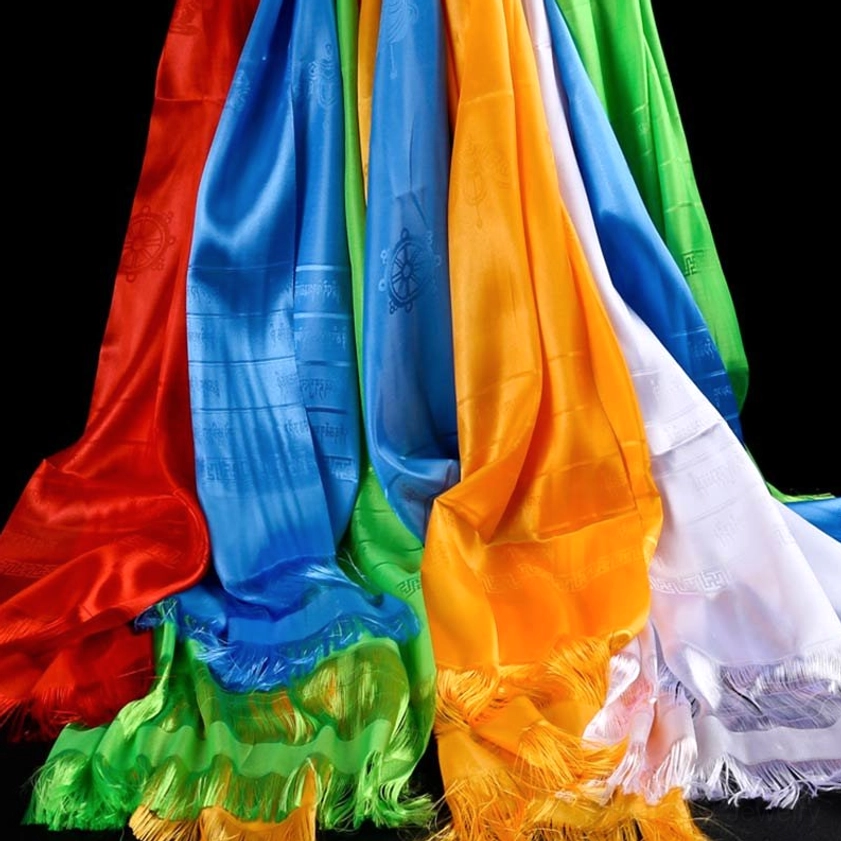 Multi-color five blessing khata scarves displayed with hanging oblique view showing satin fabric texture and embossed religious patterns