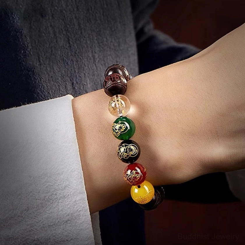 Handmade red sandalwood bracelet with Five Directions Wealth Gods symbolism for prosperity and abundance