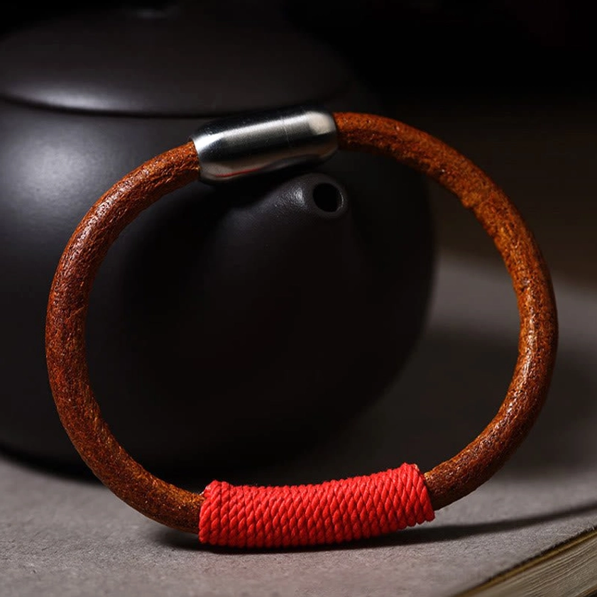 Five elements leather bracelet collection display showing variety of color options for different spiritual intentions