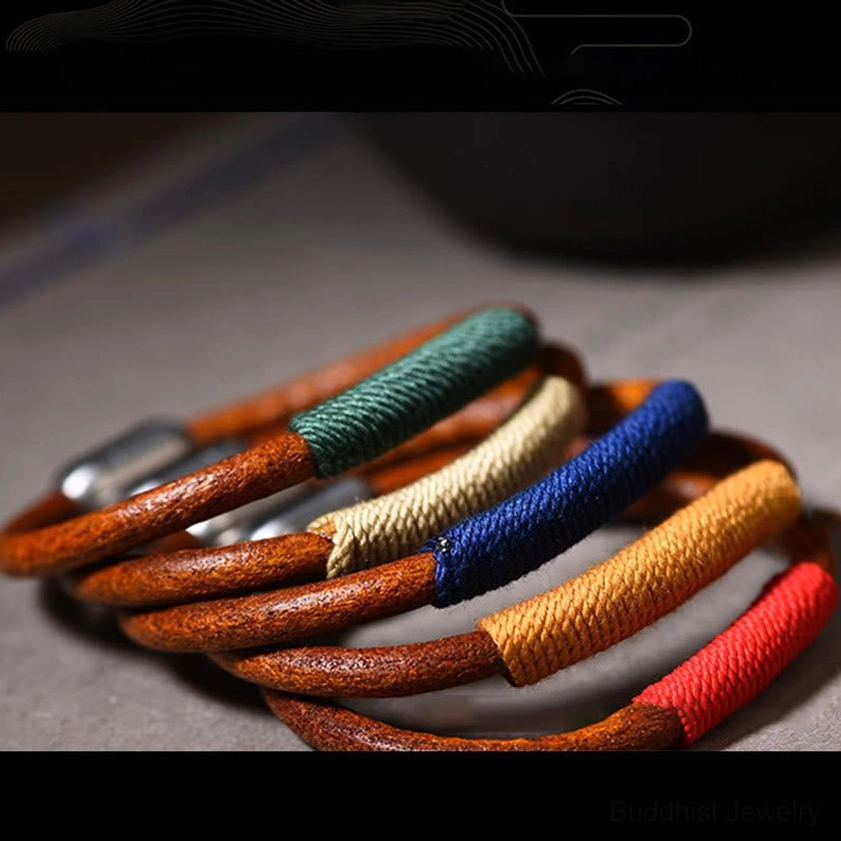 Five elements leather braided bracelet packaged for gift presentation with Buddhist spiritual significance