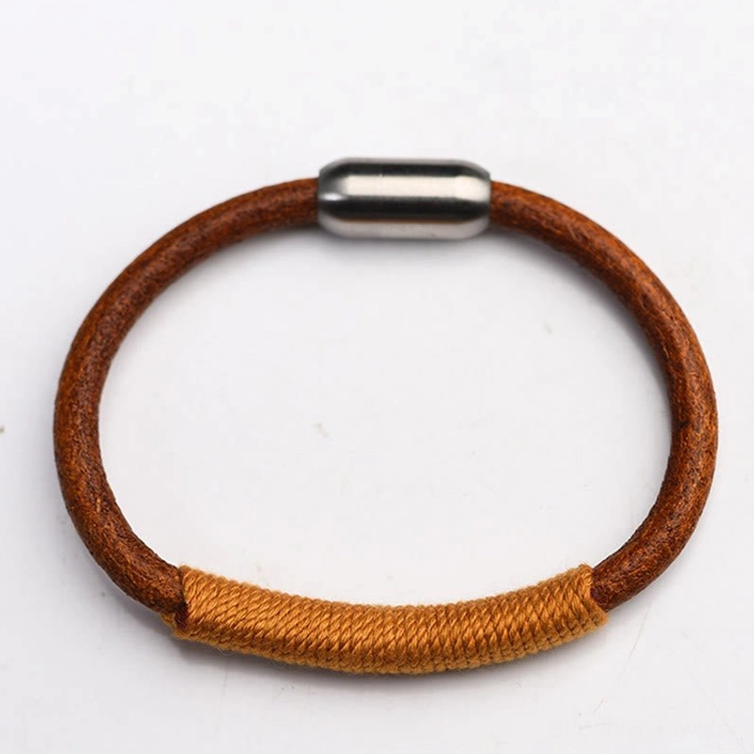 Handmade five elements leather bracelet showing craftsmanship and woven colored thread detail