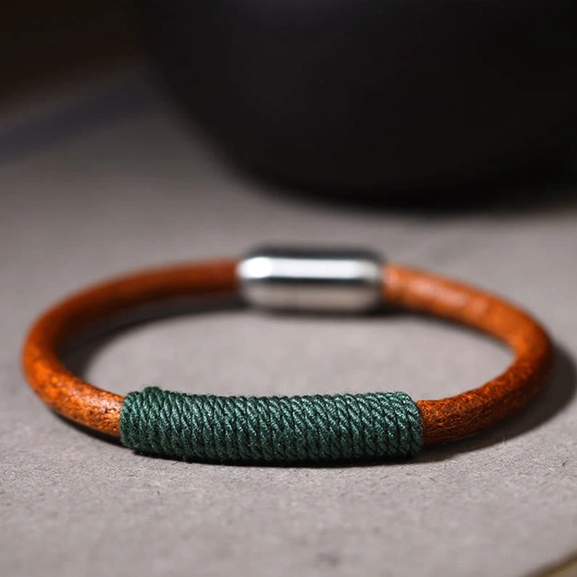 Single five elements leather bracelet with dark green woven section and magnetic buckle side view