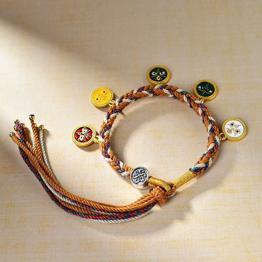 Buddhist string bracelet with five round enamel prosperity charms on braided multicolor rope with long adjustable tassel closure detail