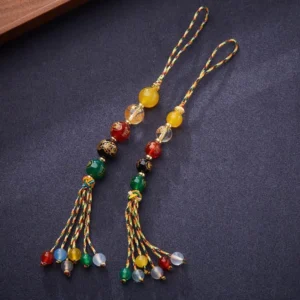 Five Gods of Wealth agate hanging charm flat lay showing two matching pairs with mixed colored agate beads and colorful braided tassels