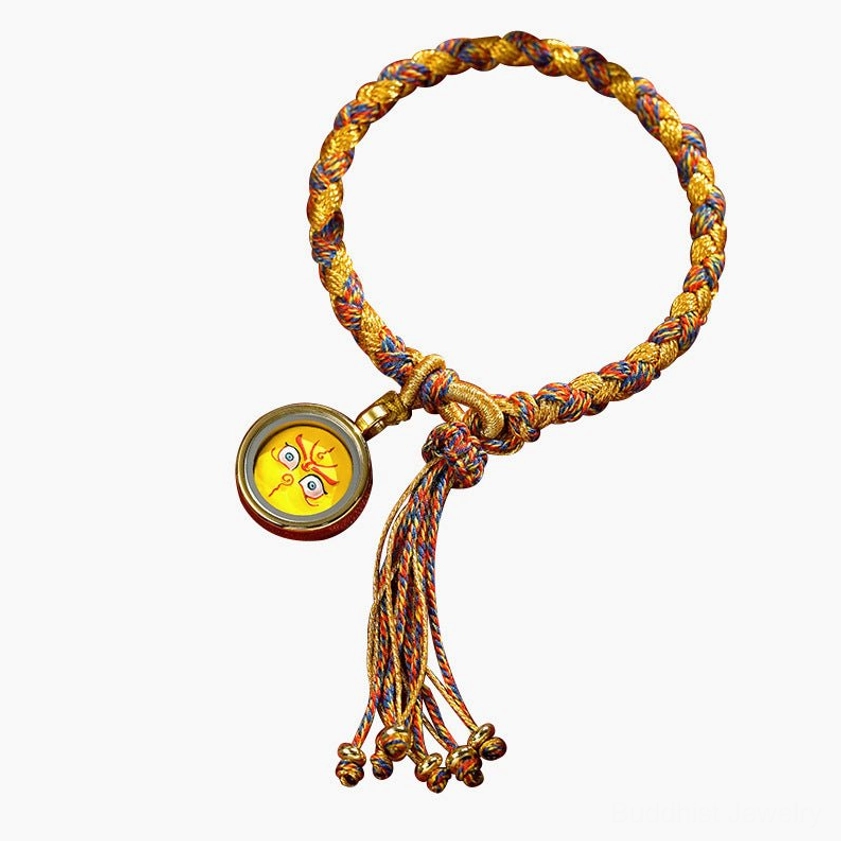 Five Gods of Wealth braided luck bracelet with gold-brown rope, yellow amulet charm, and decorative bell tassel, Buddhist prosperity wear