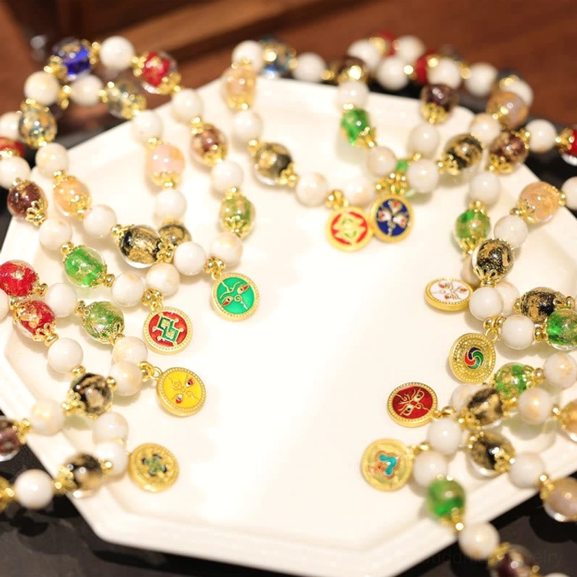 Five Gods of Wealth Buddhist charm bracelets handcrafted with incense ash porcelain and liuli glass beads for protection and abundance