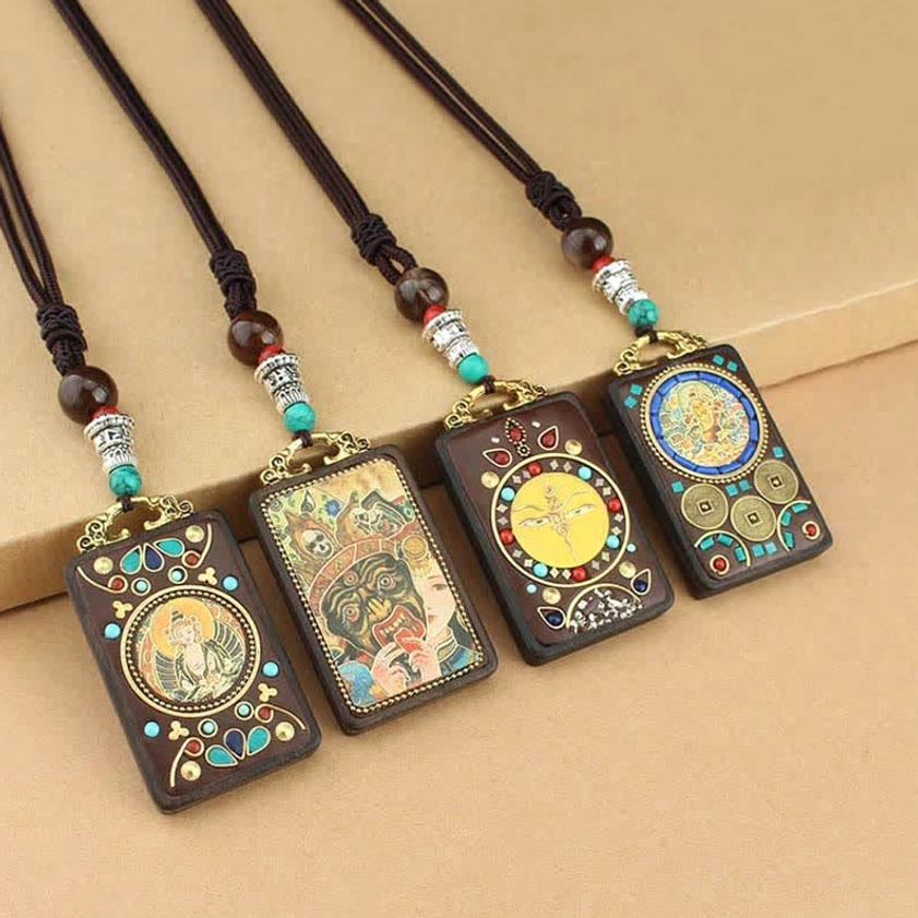 Five Gods of Wealth Buddhist Thangka ebony pendant necklace lifestyle shot, showing necklace worn close to heart with protective amulet energy