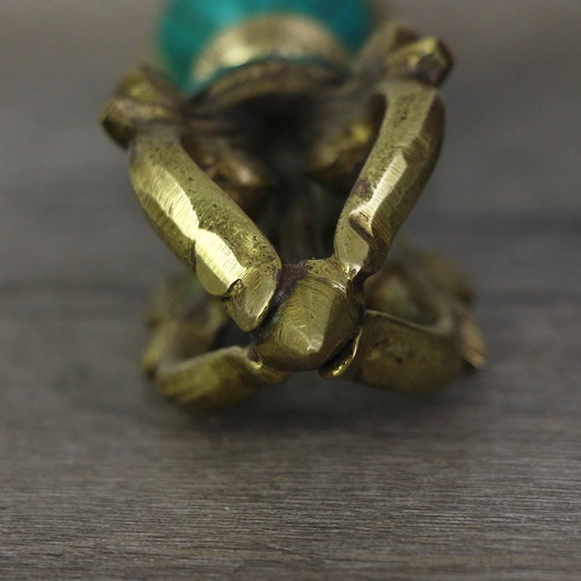 Close-up top view of five-prong vajra dorje showing solid brass casting and detailed prong design