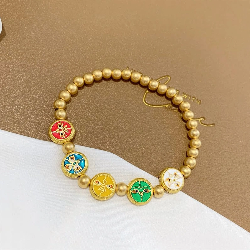 Gold-plated copper bead prosperity bracelet with adjustable elastic cord and enamel wealth deity charms