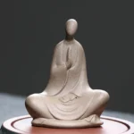 Formless Buddhist ceramic meditation statue brown - front view showing prayer hands and seated pose