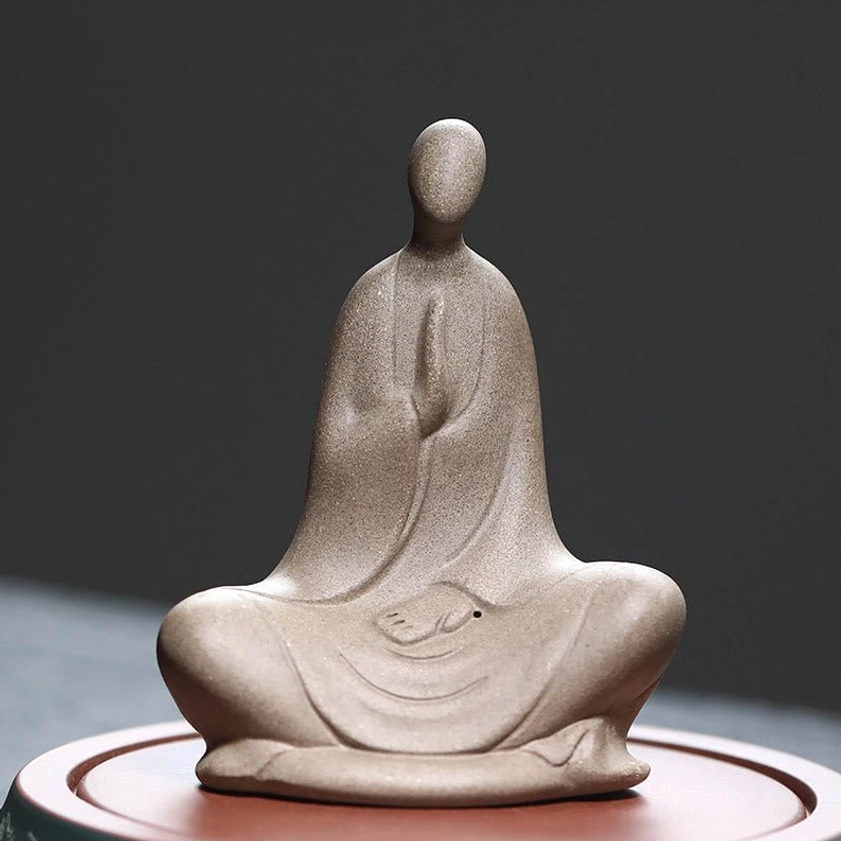 Formless Buddhist ceramic meditation statue brown - front view showing prayer hands and seated pose