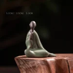 Small formless Buddha ceramic statue with celadon green glaze, handcrafted meditation decor for mindfulness and serenity