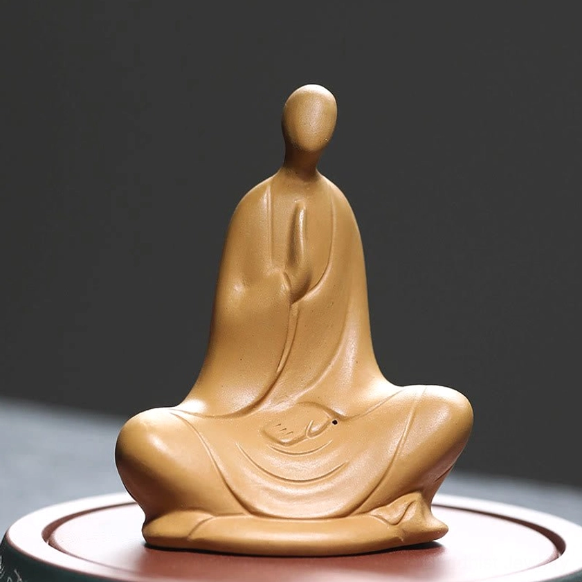 Formless Buddhist ceramic meditation statue yellow - front view with prayer hands and robes