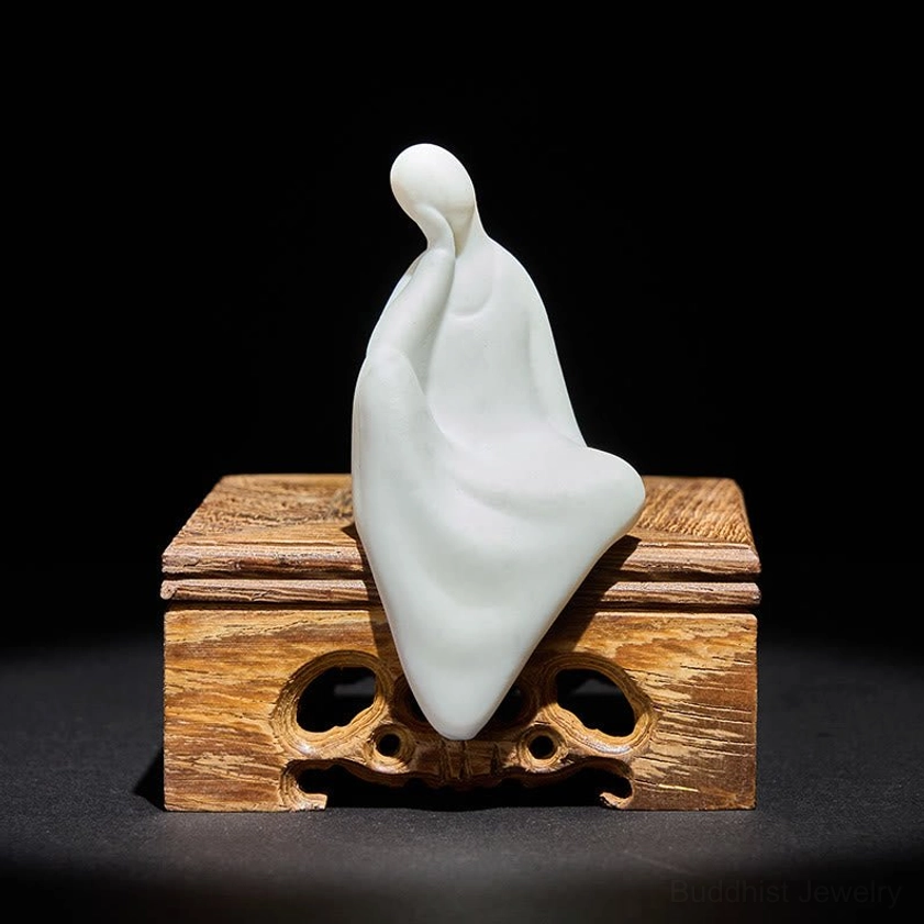 Formless Buddha ceramic white sculpture with intricate carved wenge wood display stand, left three-quarter view showing serene spiritual design