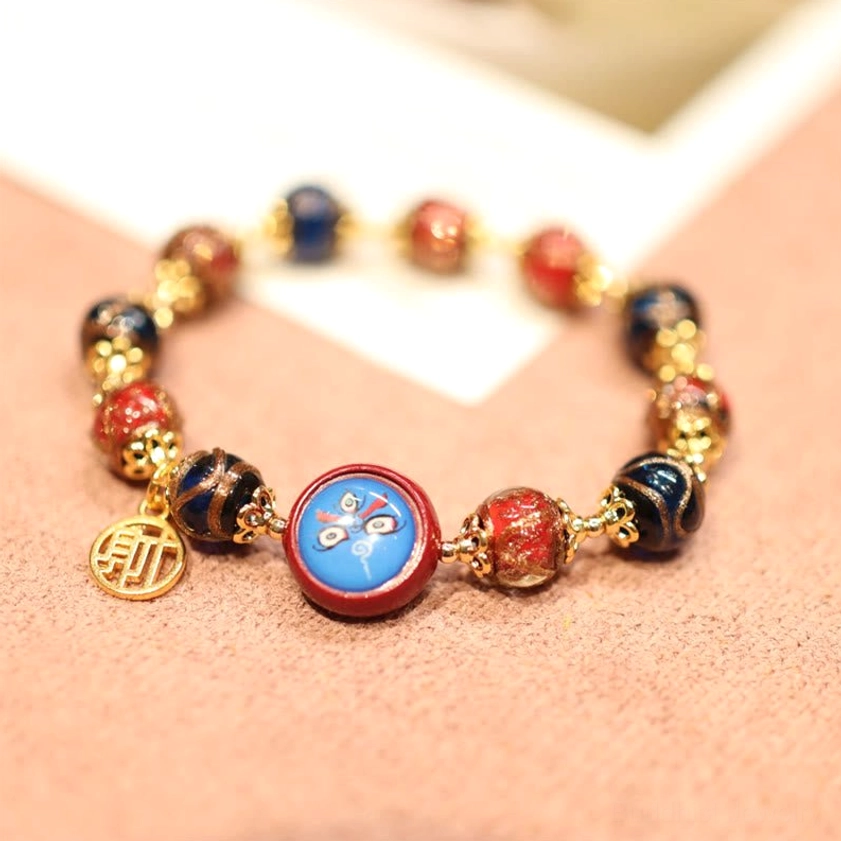 Fortune bead bracelet with Chinese fortune character charm pendant and cloisonne round bead flatlay