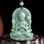 Four-armed Avalokitesvara natural jade pendant necklace front view with hand-carved relief detail